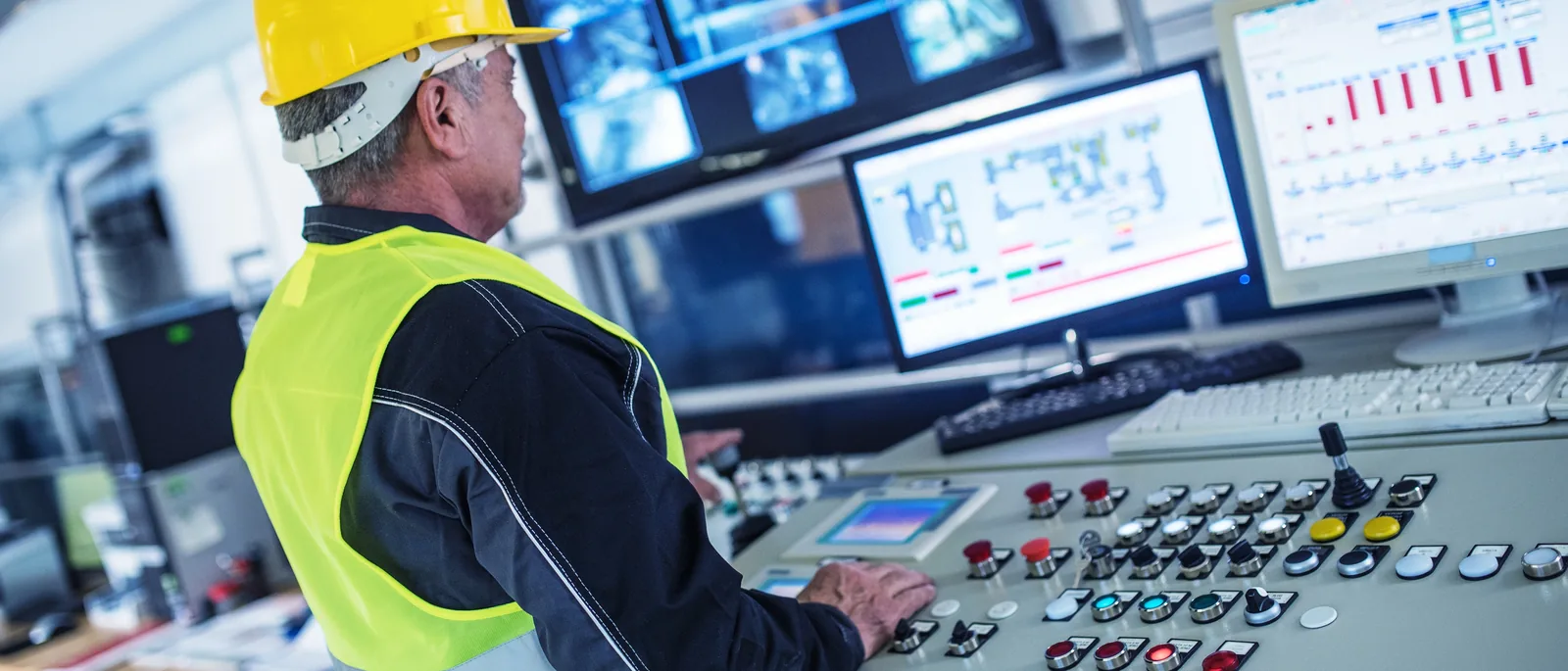 Engineer reviewing utility monitoring data in a control room